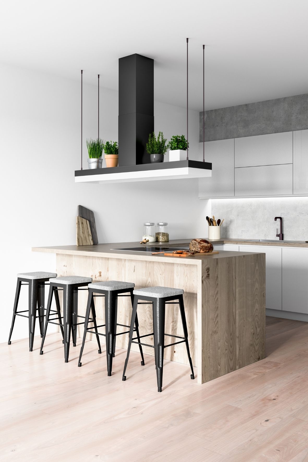 Cuisine avec grand îlot en pierre, luminaires suspendus et espace repas ouvert dans une résidence  sur la Rive-Sud de Québec